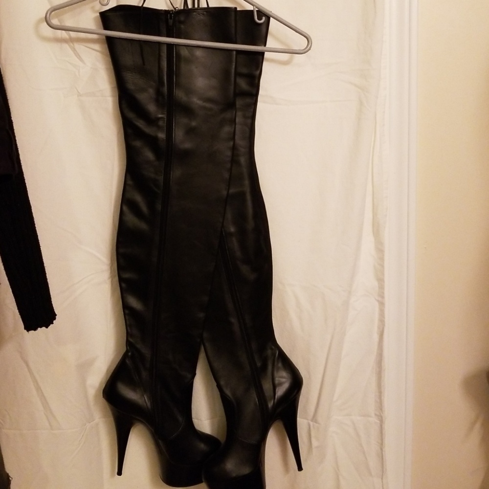 Thigh high leather boots.